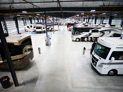 Photo of Interior of service center with about half a dozen RVs at different service bays at General RV Ashland Supercenter