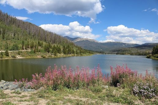 Photo of a lake and surrounding folliage and mountains at State Forest State Park in Colorado.