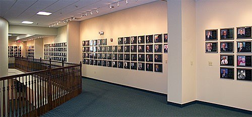 A picture of a wall at the RV/MH Hall of Fame covered in plaques