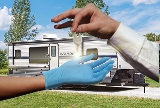 An RV owner hands RV keys to a doctor