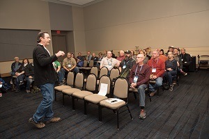 A picture of Joe Moore speaking at OHCE 2019