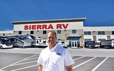 A picture of Jared Jensen, owner of Sierra RV, in front of his dealership