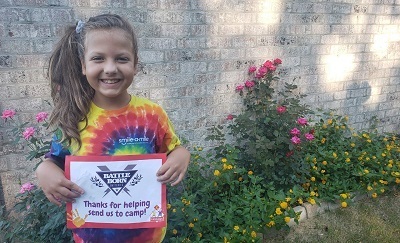 A picture of Care Camps kid thanking sponsor Battle Born Batteries