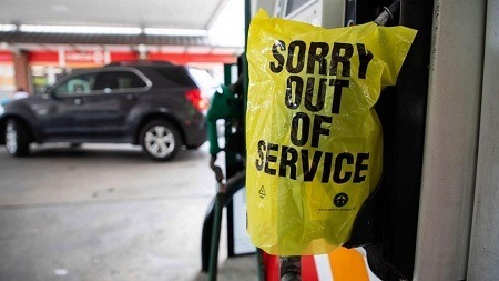 A stock picture of a gas pump with a yellow bag over the handle saying Sorry Out of Service