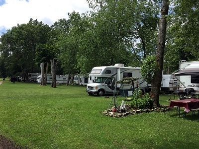 A picture of RVs at the Happy Green Acres Campground, which was recently bought by Leisure Days RV