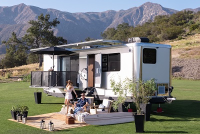 A picture of a Living Vehicle luxury travel trailer 2022 model.