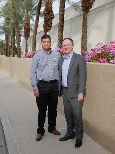 A picture of Newmar President Matt Miller with Winnebago President and CEO Mike Happe