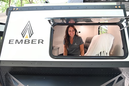 Ember RV President and CEO Ashley Bontrager looks out the open window of a 2022 prototype RV
