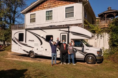 A picture of the winners of RV Retailer's contest to win a free Jayco motorhome
