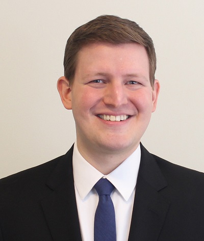 A formal suit picture up close of Sobel University President Jered Sobel