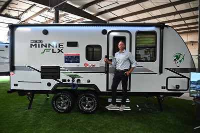 A picture of Adam Christoffersen standing outside a 2022 Micro Minnie FLX