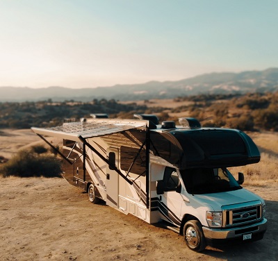 A picture of Xponent's Xpanse Solar Awning off the side of a Type C motorhome