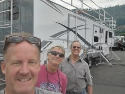 A picture of Easy Access President Dan Visser and two other men in front of a fifth wheel with an Easy Access platform set up.