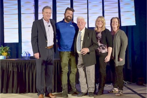 A picture of George O’Leary (center), along with family and employees, accepting the Park of the Year Award in 2019.