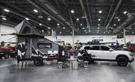 A picture of Lance Camper's latest prototype camper and demonstration vehicle, together called the “Adventure Pass,” at the 2021 SEMA Show featuring the Enduro concept travel trailer.
