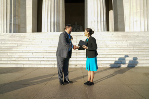 A picture of Chuck Sams (left) and DOI Secretary Deb Haaland at Sams' swearing-in ceremony.