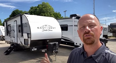 A screenshot of Bish's RV's Josh the RV Nerd touring an East to West Della Terra travel trailer