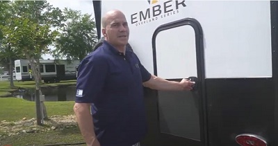 A screenshot of a video walkthrough of the Ember 191MDB travel trailer by Campers Inn's Ken Goethals