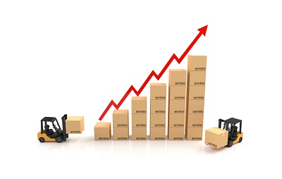 A stock image representing wholesale inflation with boxes stacked higher and a red arrow pointing up