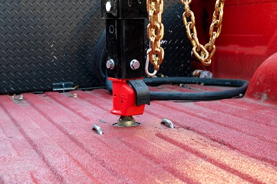 Picture of an easy-latch coupler in the bed of a truck