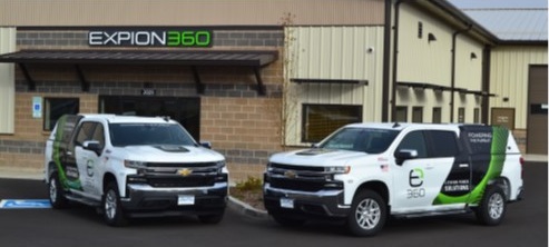 A picture of two Expion360 mobile demonstration trucks