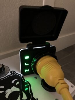 A picture of the SafeView Power Inlet with green lights lit
