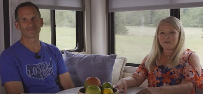 A picture of Julie and Marc Bennett in their camper.