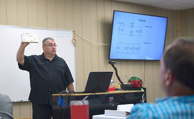 A picture of Chris Wilson of NRVTA instructing in front of a classroom