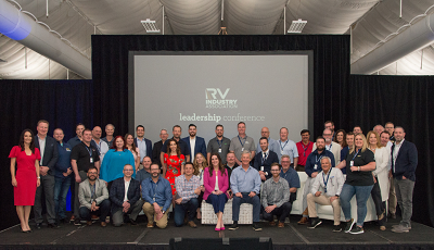 A picture of RVIA emerging leaders coalition group indoors in front of a large projection screen