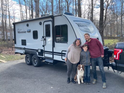 A picture of RV On Call CEO and his family in front of a travel trailer