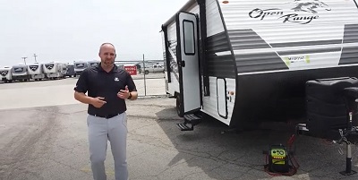 A screenshot of a video walkthrough of a Highland Ridge RV Open Range travel trailer by national sales manager Ben Johnson