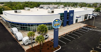 A picture of a dealership with the new Blue Compass RV branding