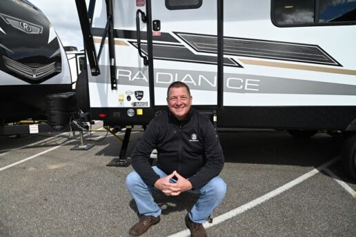 A picture of Cruiser RV GM Dave Burroughs outside a Radiance travel trailer at the 2022 Elkhart Extravaganza event in Elkhart, Indiana.