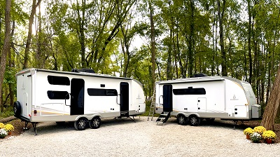 An exterior picture of two Ember RV Touring Edition travel trailers