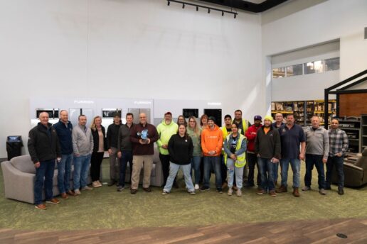 A picture of the Furrion staff showcasing their Jayco Blue Excellence Award.