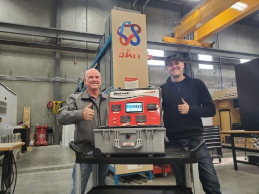 A picture of Garnet Instruments Business Development Manager Stewart Purvis (L) and Southern Alberta Institute of Technology (SAIT) lab technician Andrew Marquis (R) smiling next to the SeeLeveL demonstration kit.