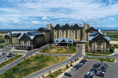 A picture of the exterior of the Gaylord Rockies Hotel & Convention Center in Aurora, Colorado, site of the 2023 NTP-Stag Expo