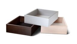 A picture of boxes stacked atop each other, made by BHK Durawrap, which was acquired by Genesis Products.