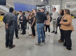 A picture of Startup Moxie students touring a Grand Design RV facility.