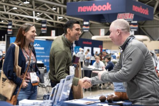 A picture of Outdoor Hospitality Industry Conference and Expo 2023 attendees on the expo floor.