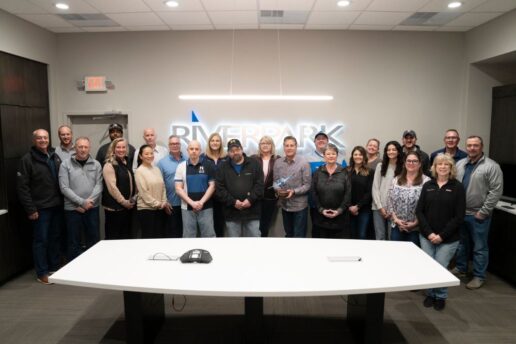 A picture of the River Park staff showcasing their Jayco Blue Excellence Award.