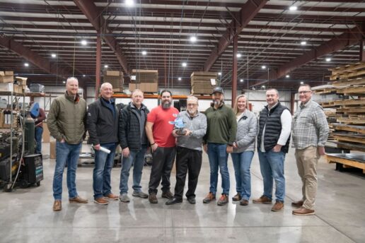 A picture of the S&H Metal Products staff showcasing their Jayco Blue Excellence Award.