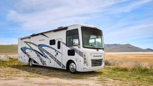 A picture of the exterior of the 2024 Hurricane Type A motorhome out in the plains near Utah mountains.