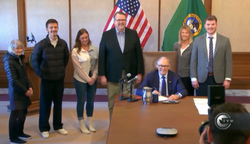 A picture of Washington Gov. Jay Inslee signing the HB 1996 bill into a law. The law is an RV-specific franchise law.