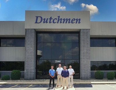 A picture of Dutchmen RV's leadership team outside the manufacturer's headquarters