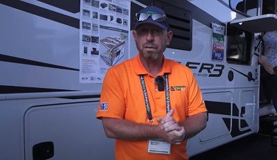 A screenshot of Campers Inn's Anthony Haines preparing to lead viewers on a tour of a 2023 Forest River FR3 30DS
