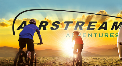 A picture of the Airstream Adventures backsplash with two bikers and a trailer and the Airstream Logo