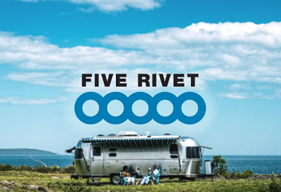 A picture of an airstream lifestyle RV shot with the Words Five Rivet and five circles printed over the RV