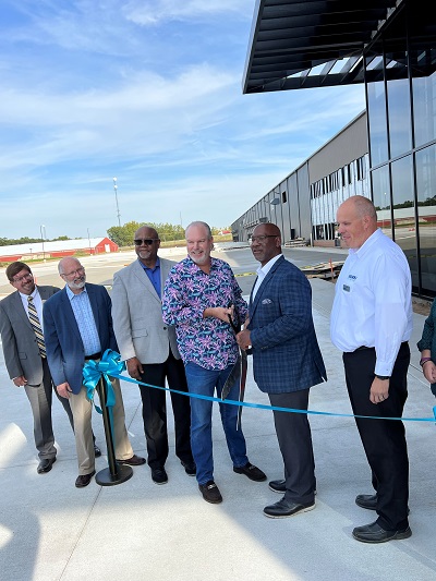 A picture of several men at Way Interglobal's New Headquarters Ribbon Cutting