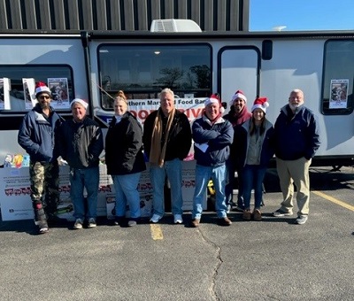 A picture of Economy RV staff at a holiday food drive